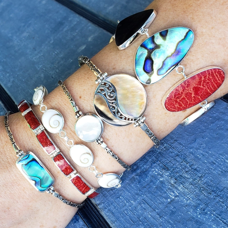 Handmade Sterling Silver Jewelry featuring natural shells and coral with exquisite colors and iridescent color play.